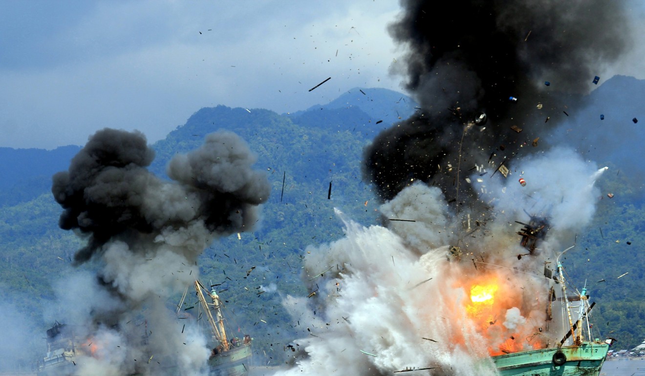 As well as cracking down on slavery aboard Thai fishing boats, Indonesia blows up foreign fishing boats suspected of conducting illegal fishing activities, like these boats in Ambon Bay. Photo: EPA