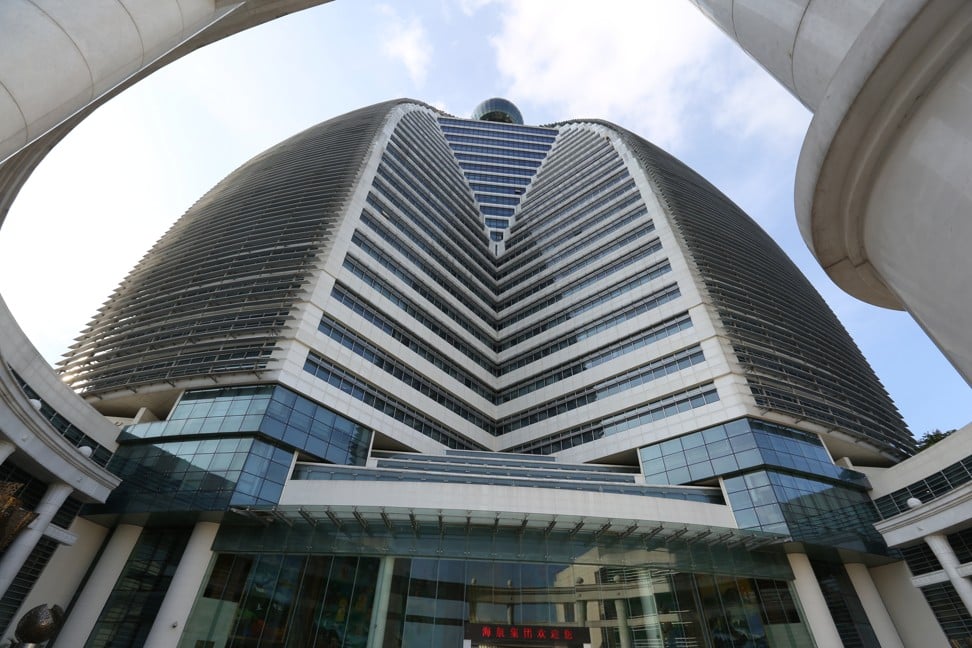 HNA’s head office building in Haikou is shaped like a sitting Buddha. A Starbucks outlet operates in the office lobby. Photo: SCMP / Xiaomei Chen