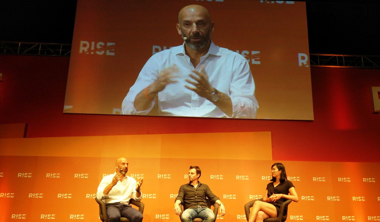 Gianluca Vialli speaks at Rise with his partner Fausto Zanetton and interviewer Kane Wu, of Reuters.