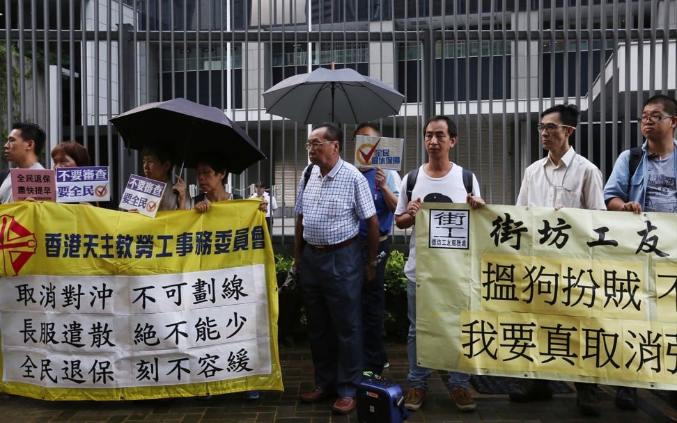 Protestors outside the Legislative Council calling on Hong Kong’s government to scrap the offset mechanism of the Mandatory Provident Fund on June 24. Photo: SCMP/Jonathan Wong