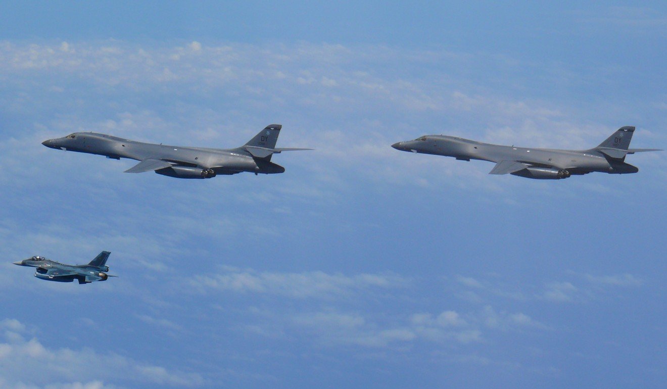 Two US Air Force B-1B Lancers and a Koku Jieitai JASDF F-2 fighter jet flying over the East China Sea in July 2017. The Lancers took off from Andersen Air Force Base in Guam. Photo: EPA