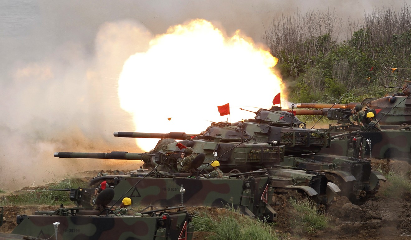 A line of US Patton tanks fire at targets during the annual Han Kuang exercises on Taiwan’s outlying Penghu Island, on May 25. Photo: AP