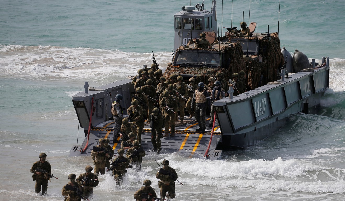 Soldiers from the Australian Army’s 3rd Brigade in an amphibious assault landing during the Talisman Sabre joint military exercises between Australia and the United States in Queensland on July 13. Photo: Reuters