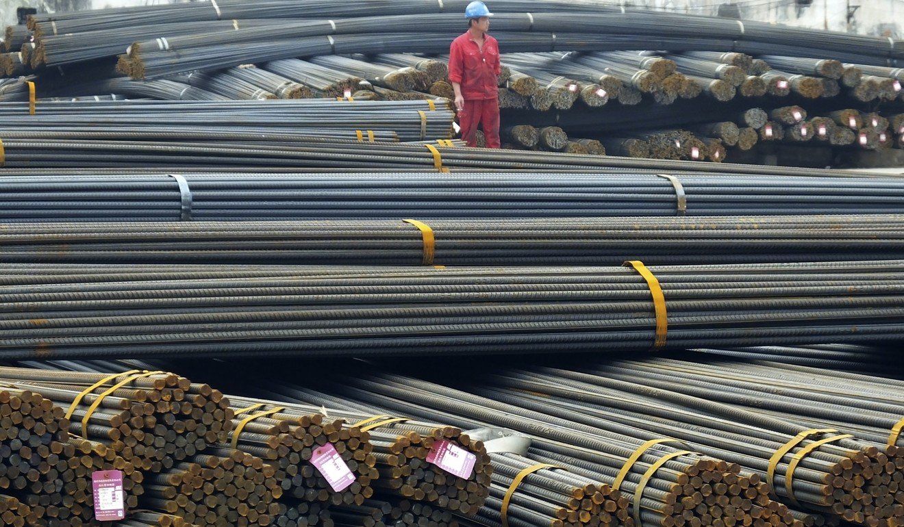 A man works in a steel market in Yichang in central China's Hubei province. Photo: Associated Press