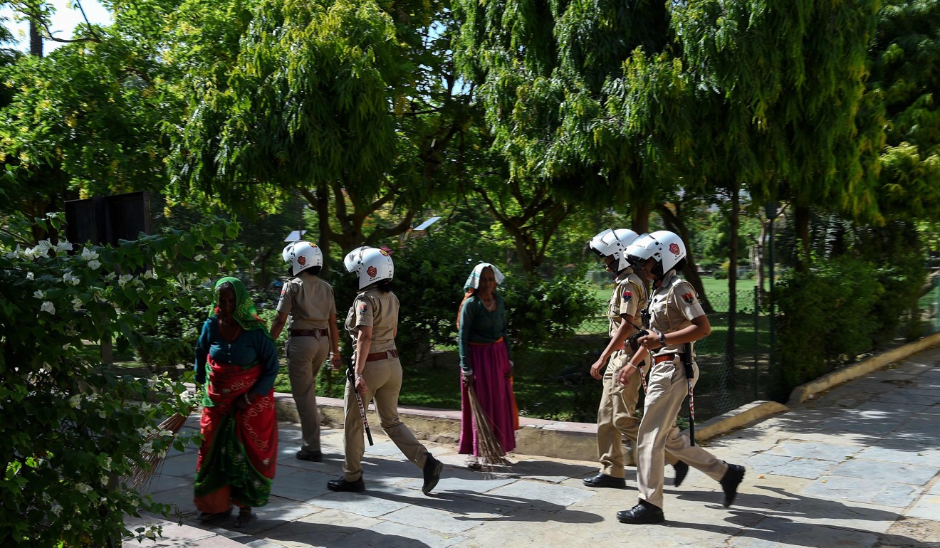 Members of a newly launched female police patrol unit take a routine survey at a park in Jaipur. Photo: AFP