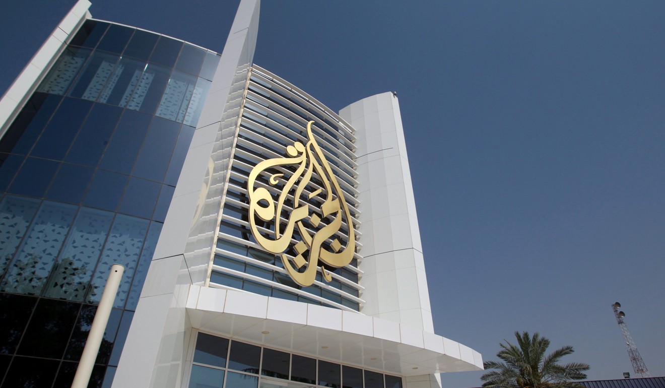 The Al-Jazeera Media Network logo is seen on its headquarters in Doha, Qatar. Photo: Reuters