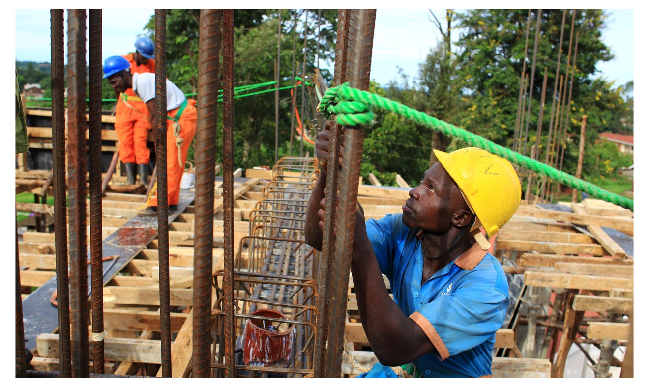 Construction workers in Uganda, where the China Communications Construction Company is a major contractor for the government Photo: Reuters