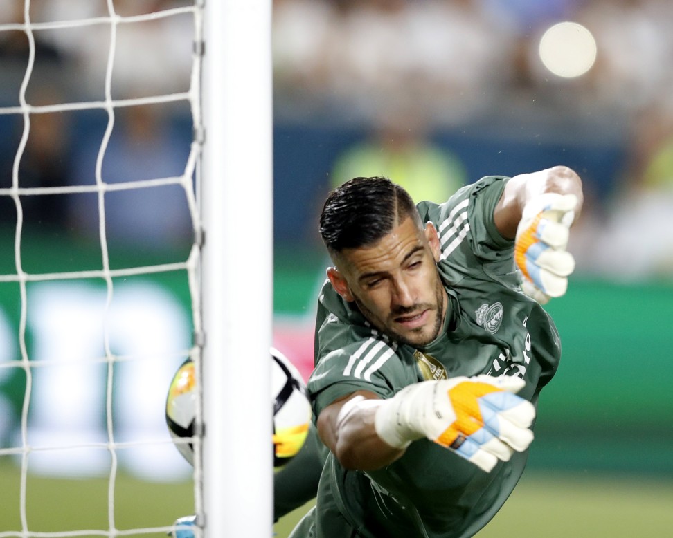 Real Madrid goalkeeper Keylor Navas makes a save against Manchester City. Photo: EPA