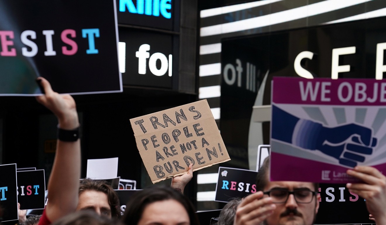People protest US President Donald Trump's announcement that he plans to reinstate a ban on transgender individuals from serving in any capacity in the US military, in Times Square, in New York City. Photo: Reuters