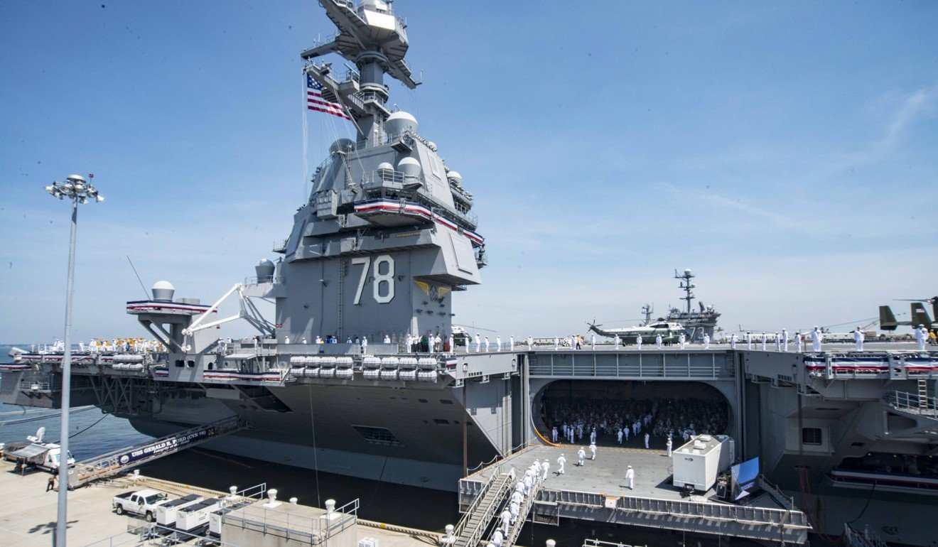 The aircraft carrier USS Gerald R. Ford is commissioned at Naval Station Norfolk, Virginia. Ford is the lead ship of the Ford-class aircraft carriers, and the first new US aircraft carrier designed in 40 years. Photo: EPA