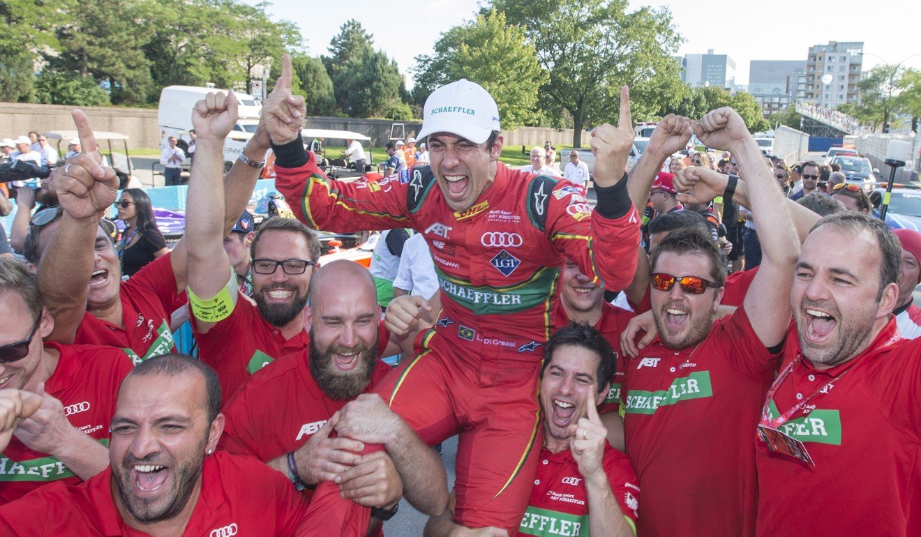 Lucas Di Grassi of Brazil, with ABT Schaeffler, is hoisted by his team after winning the driver's title at the Montreal Formula ePrix electric car race. Photo: AP