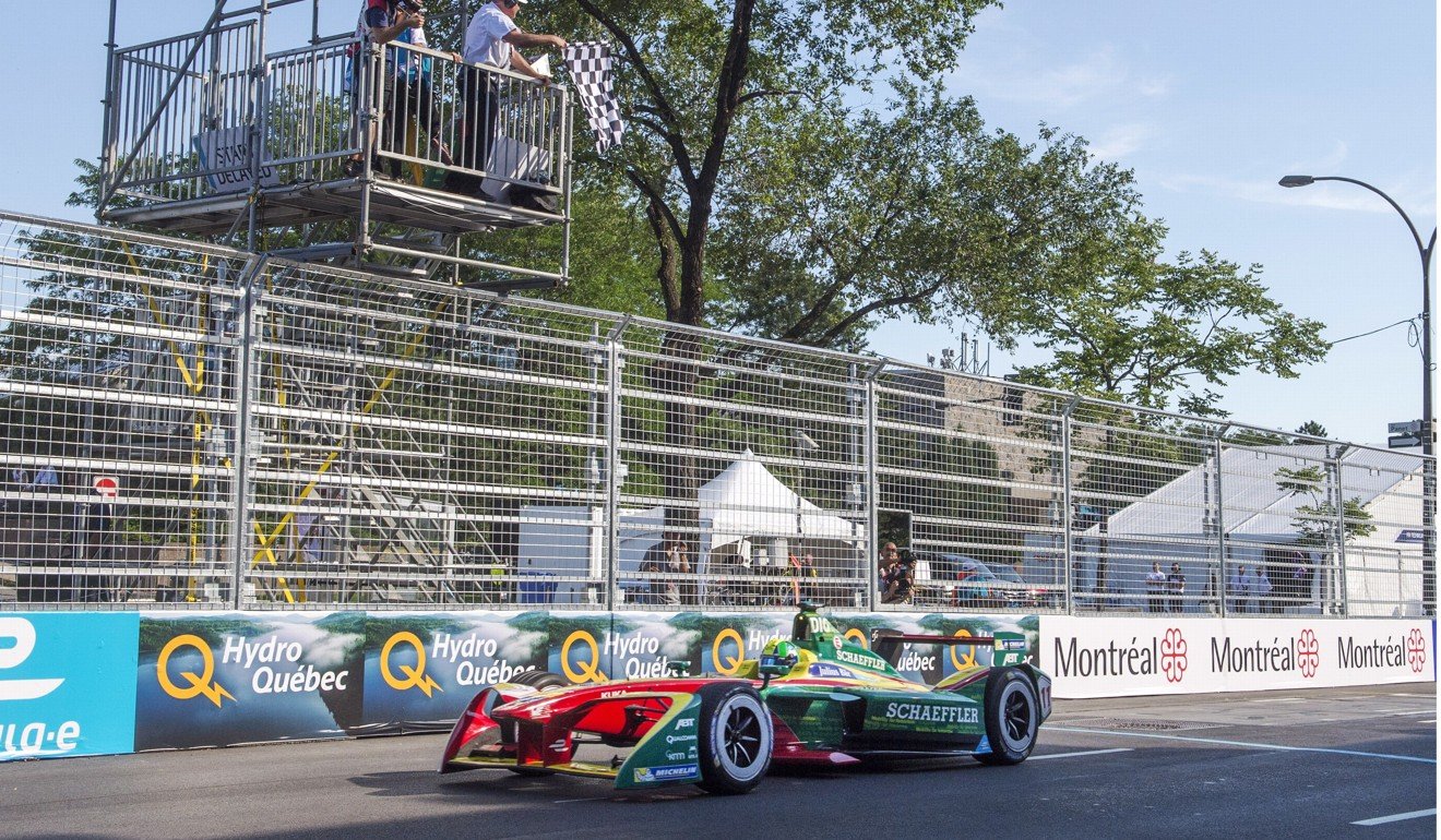 Lucas Di Grassi of Brazil, with ABT Schaeffler, crosses the finish line in seventh place to win the season three drivers championship at the Montreal Formula ePrix. Photo: AP