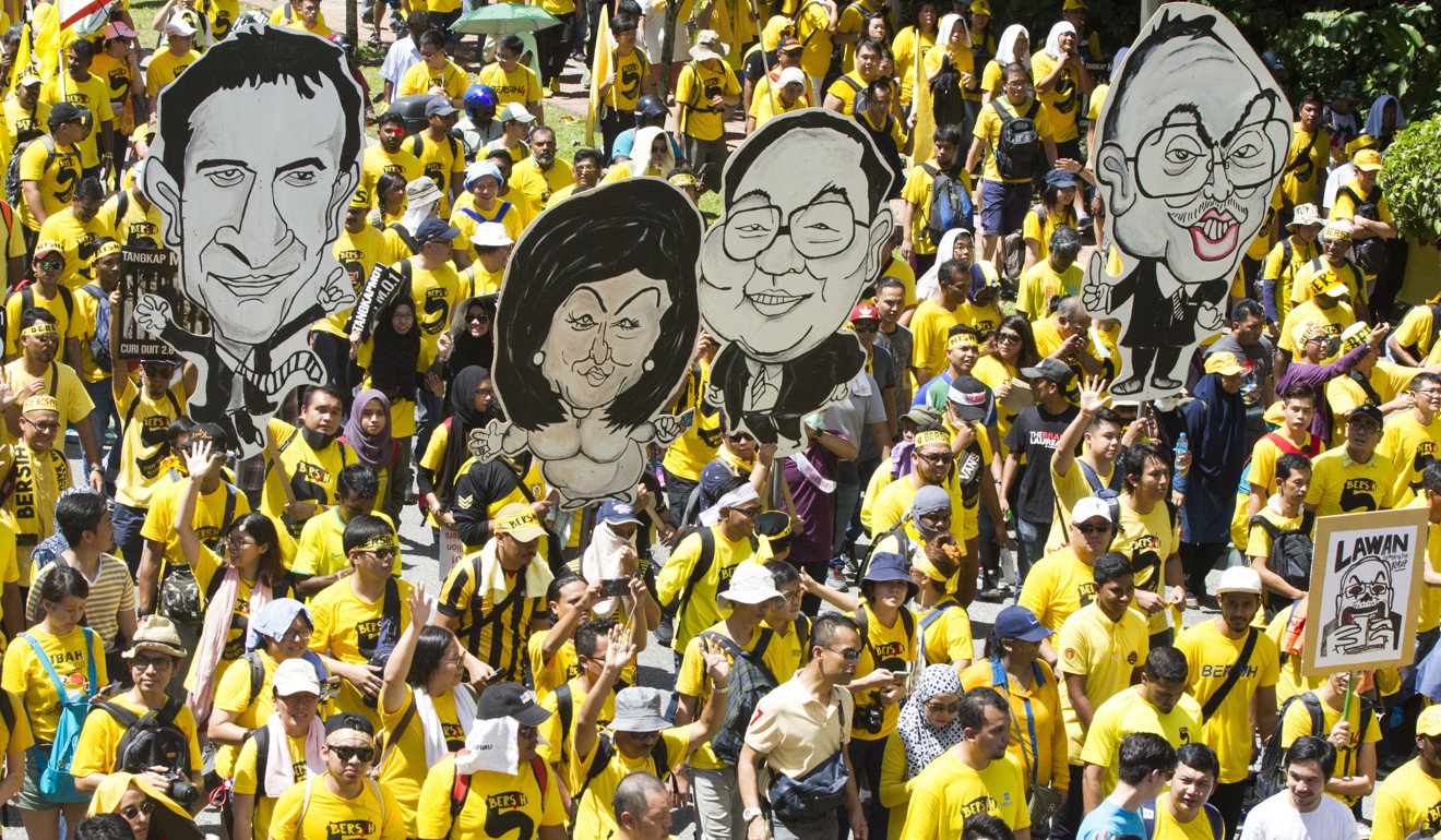 Thousands of yellow-shirt protesters rallied last year in Kuala Lumpur, seeking Prime Minister Najib Razak's resignation over a financial scandal. Photo: AP