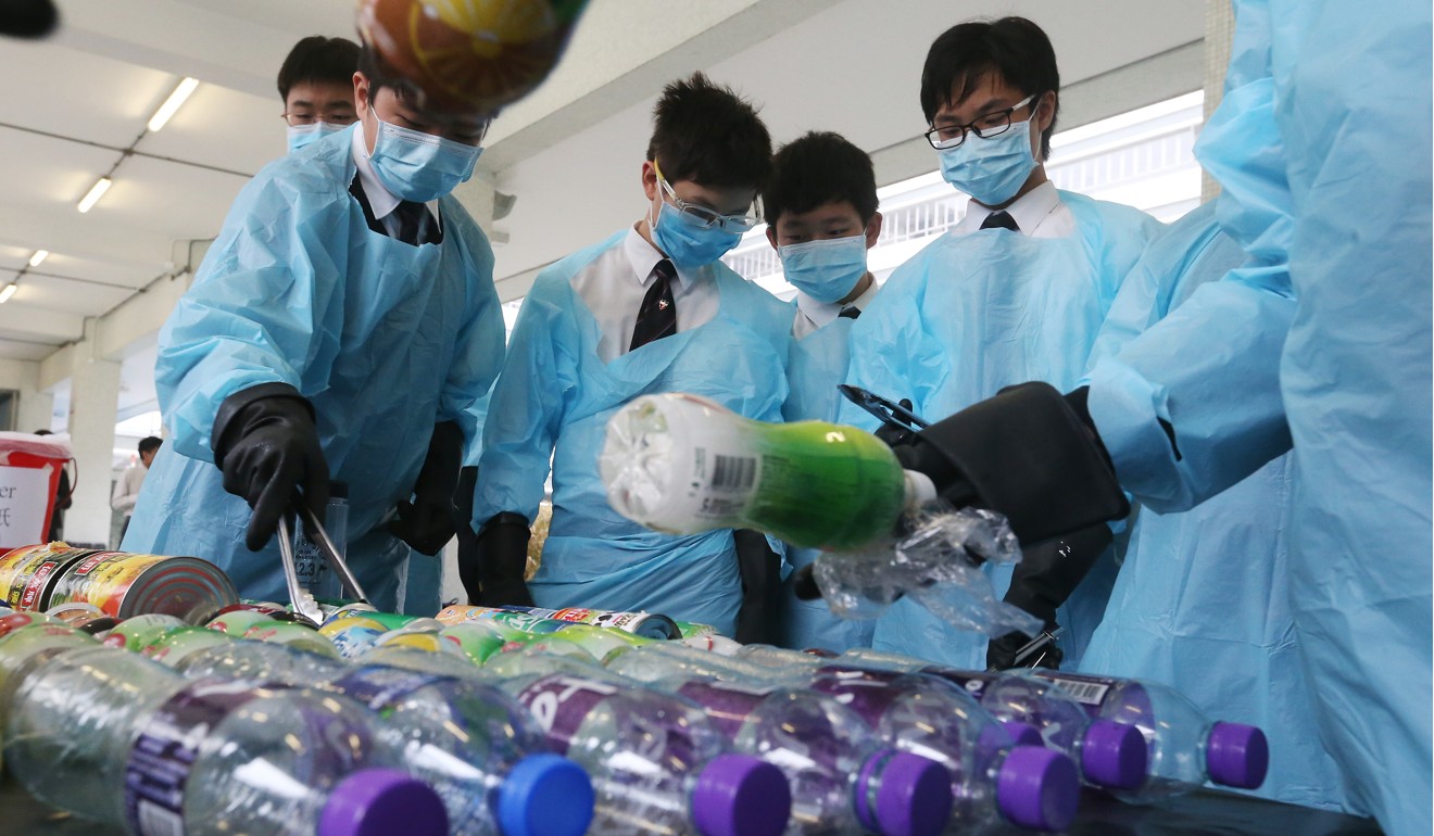 Students work on a solid waste reduction project at La Salle College in Kowloon Tong on March 30. Photo: K. Y. Cheng