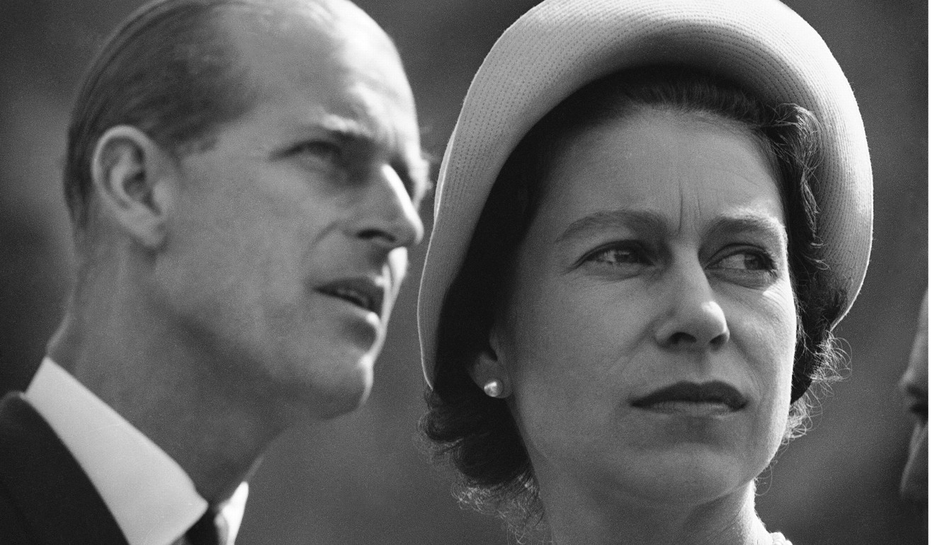 In this June 20, 1959, file photo Queen Elizabeth II and Prince Philip are pictured in Schefferville, as they listen to explanation on workings of an iron ore mine on another stop in their royal tour of Canada. Photo: AP