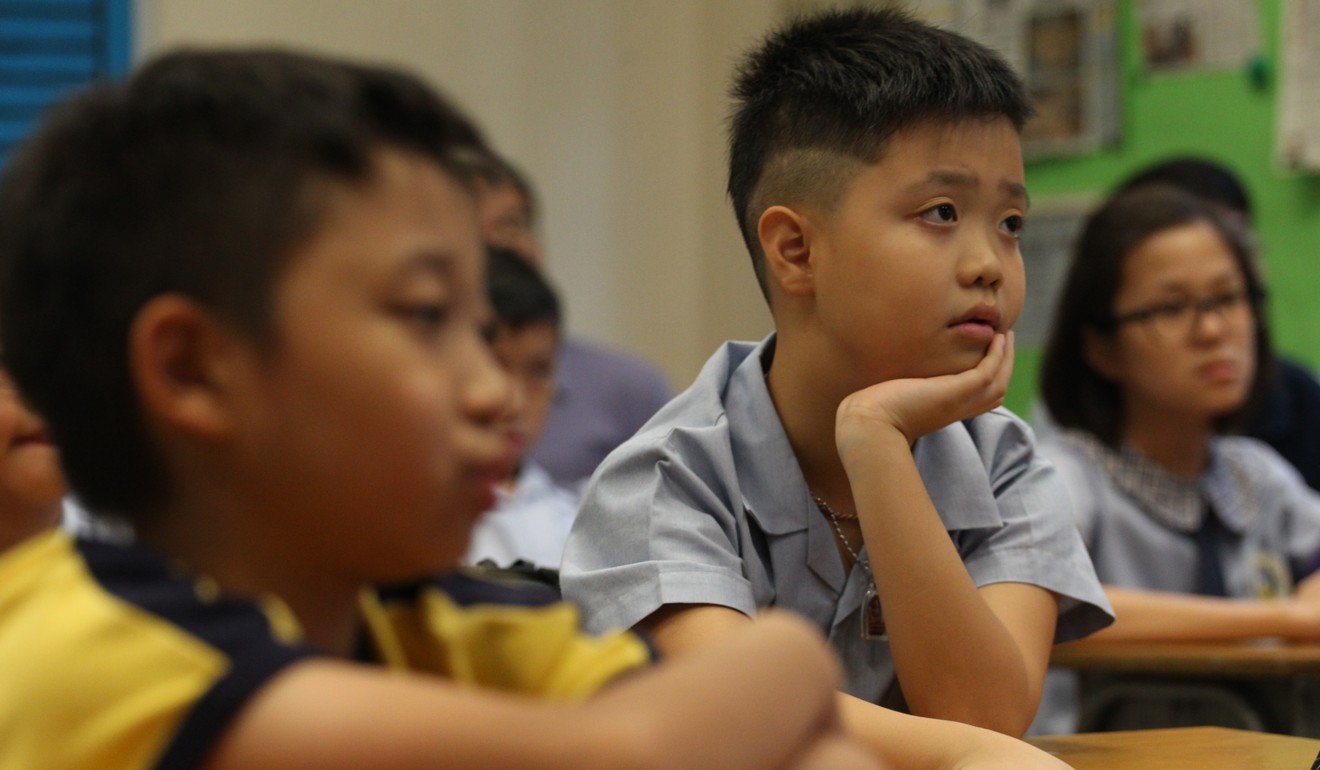 Children take a national education class in 2013 at Fresh Fish Traders’ School. Photo: Felix Wong