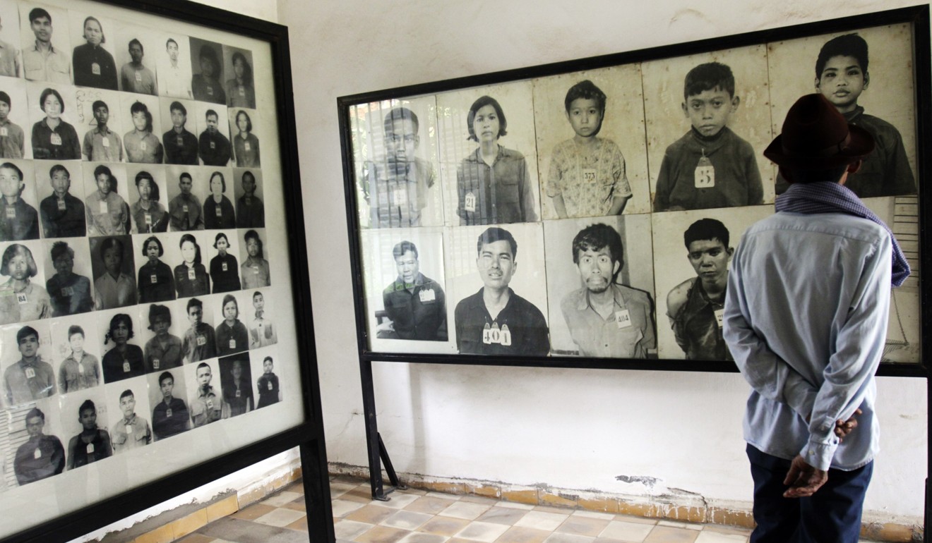 Photographs of victims killed by the Khmer Rouge at the notorious S-21 prison, in Phnom Penh. Picture: Reuters