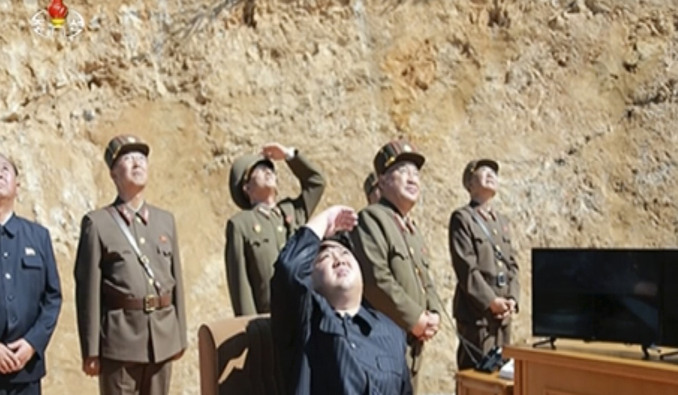 This file image made from video of a news bulletin aired by North Korea's KRT on July 4, 2017, shows what was said to be North Korea leader Kim Jung-un, centre, watching the launch of a Hwasong-14 intercontinental ballistic missile. Photo: KRT via AP