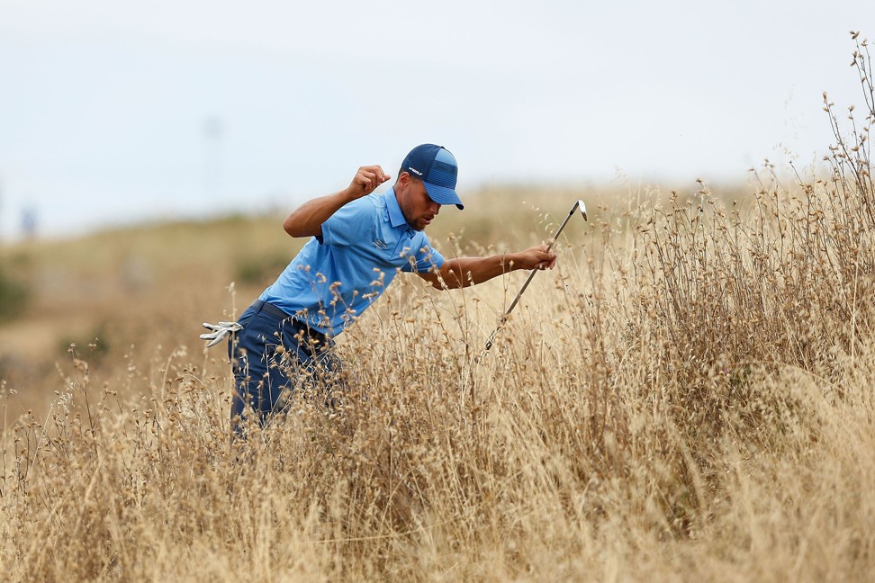 Curry looks for his ball out of bounds during round one. Photo: AFP