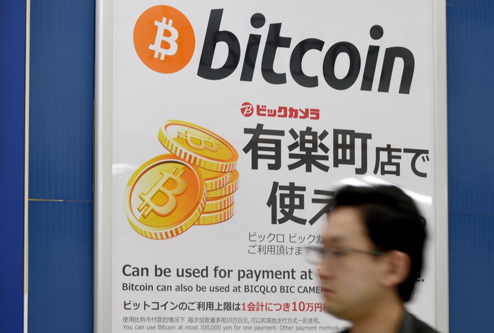 A sign informs customers that bitcoin can be used for payment at a store in Tokyo. Photo: AFP