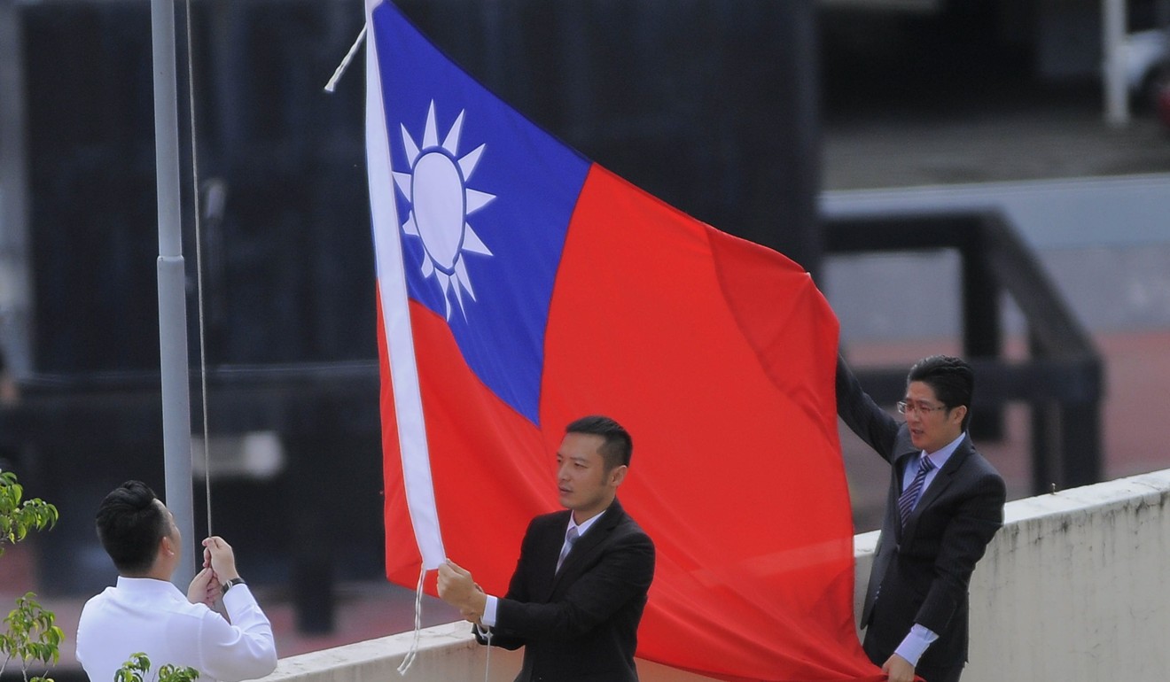 The flag comes down at Taiwan’s diplomatic mission in Panama City, Panama, on 14 June. Photo: EPA