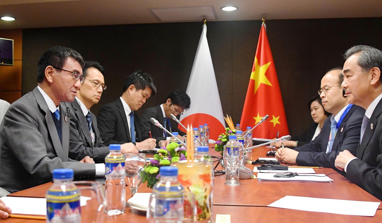 Japanese Foreign Minister Taro Kono (left) and his Chinese counterpart Wang Yi (right) pictured during their talks in Manila. Photo: Kyodo