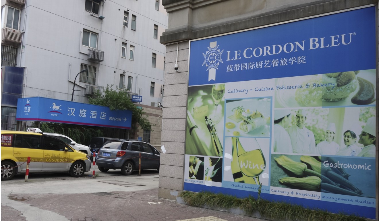 The sign for Le Cordon Bleu posted near the entrance of a vacant hotel. Photo: Juli Min