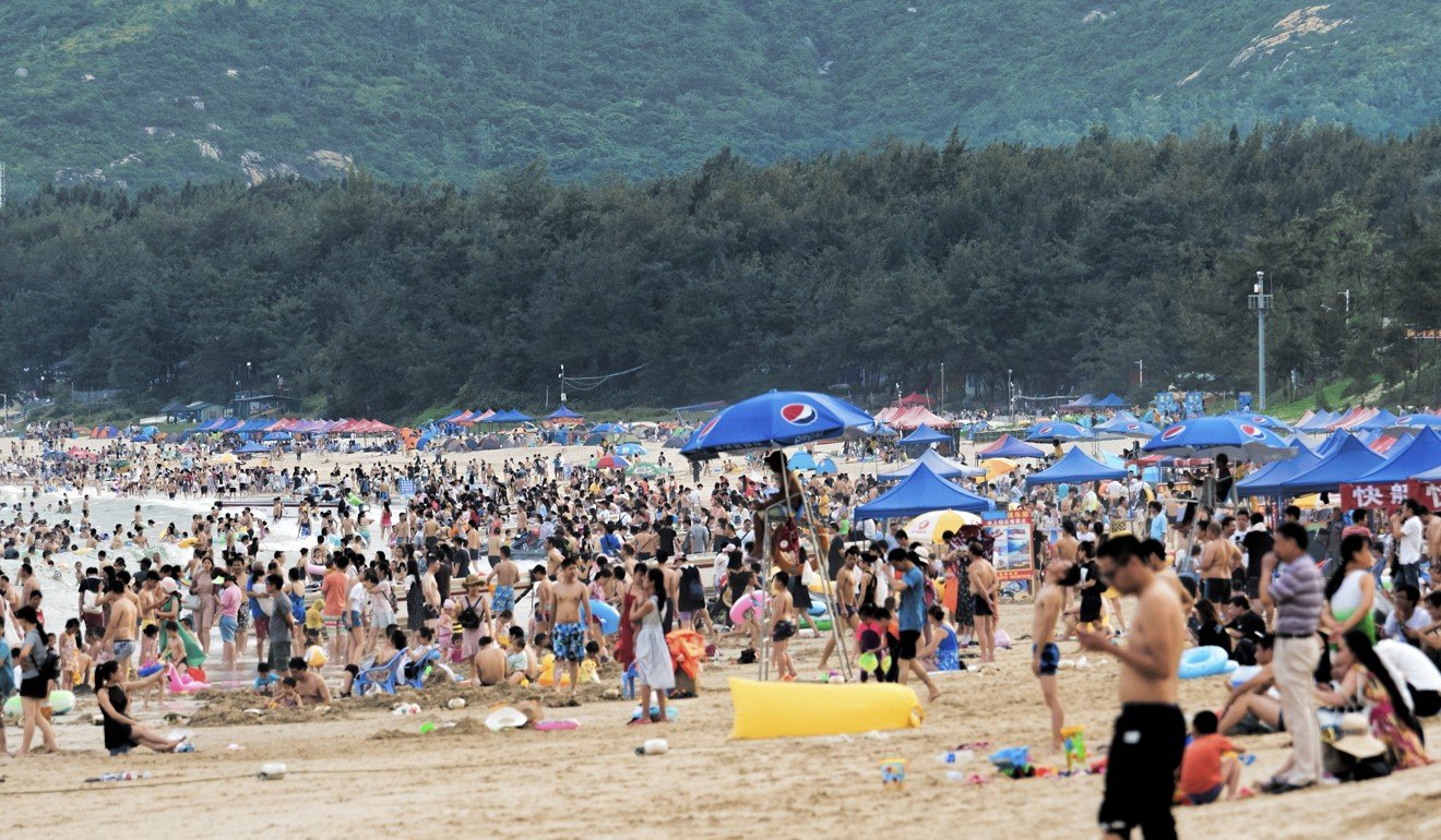 The crowds at Xichong beach. Photo: Martin Williams