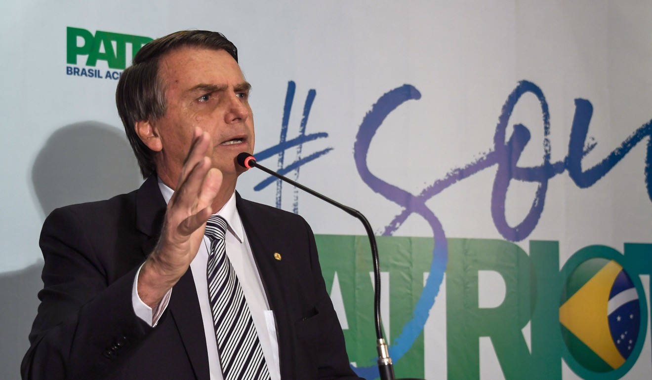 Brazilian deputy Jair Bolsonaro speaks during a press conference he called to announce his intention to run for the Brazilian presidency in the October 2018 election, at a hotel in Rio de Janeiro on Thursday. Photo: AFP