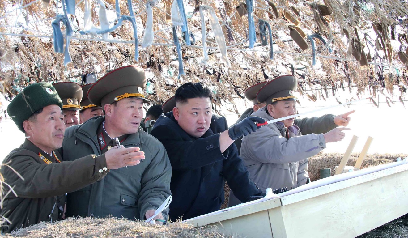 A photo released by KCNA news agency in 2013, shows North Korea leader Kim Jong-un visiting the Wolnae-do Defence Detachment on the western front line. Photo: MCT
