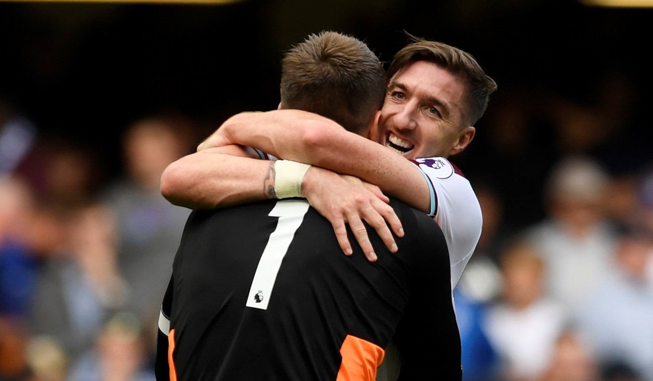 Burnley's Tom Heaton celebrates after the match with Stephen Ward after their stunning victory. Photo: Reuters