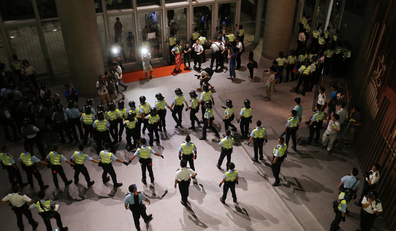 Police officers standing guard during the Legco finance committee meeting. Photo: Felix Wong
