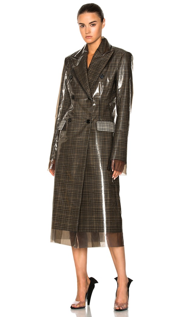 Calvin Klein’s 205W39NYC Glen Plaid Wool & Matte Polyurethane Film Trench Coat.