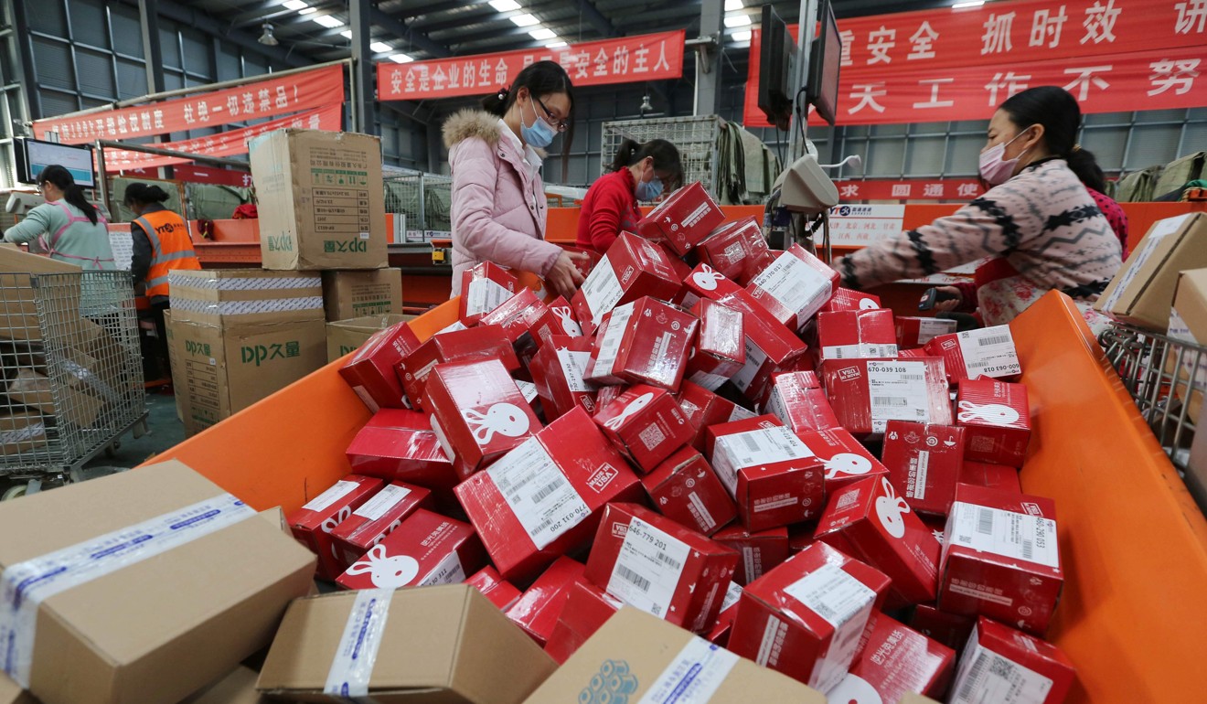 Workers prepare boxes for packaging goods for delivery at a sorting centre in Jiangsu province, during the Singles Day online shopping festival last November 11. Chinese consumers spent US$17.8 billion online that day. Photo: AFP