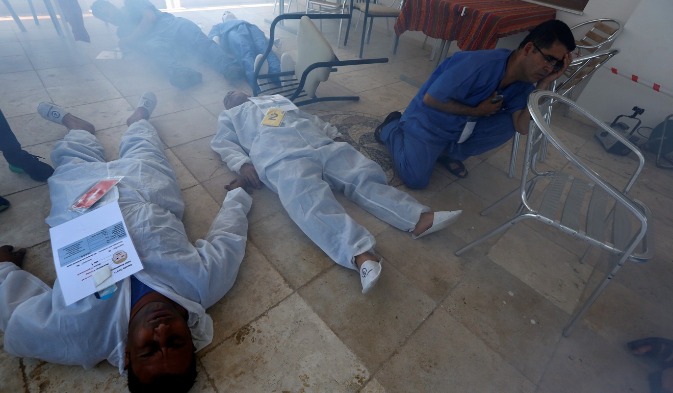 Syrian medical staff take part in a training exercise to learn how to treat victims of chemical weapons attacks, at a course organised by the World Health Organisation in Gaziantep, Turkey, last month. Photo: Reuters