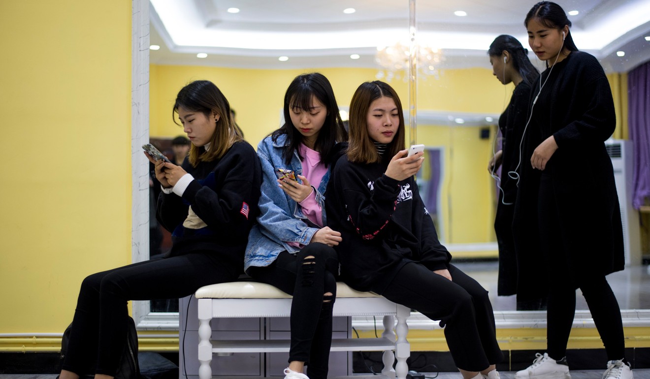 Students at the Yiwu Industrial & Commercial College in Zhejiang province. Classrooms for the mostly female students are typically dance studios, catwalks strafed by flashing lights and bustling make-up rooms. Photo: AFP
