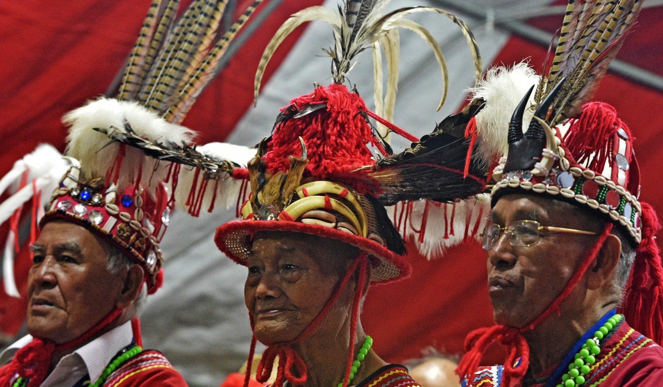 Older members of the Amis indigenous group watching the festivities. Photo: AFP