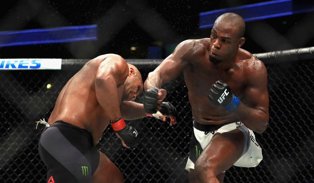 Daniel Cormier (left) was knocked out in the third round by Jon Jones in their title bout at UFC 214. Photo: AFP