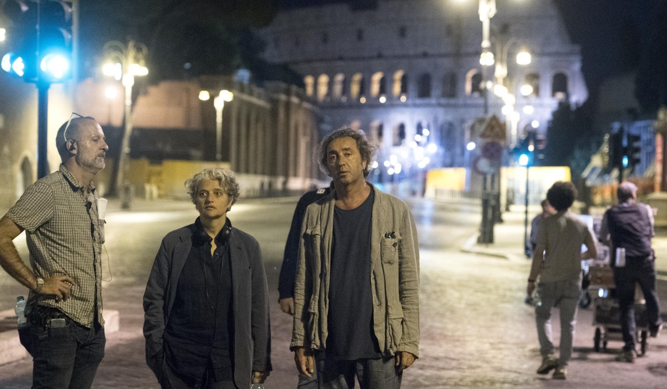 Director Paolo Sorrentino (right) on set during the shooting of Loro. Photo: EPA