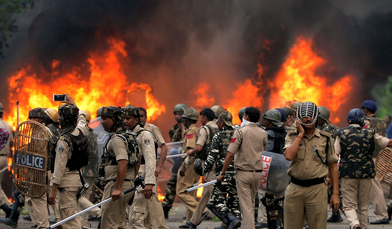 Vehicles were set alight as supporters of guru Ram Rahim clashed with security forces in Panchkula. Photo: AFP