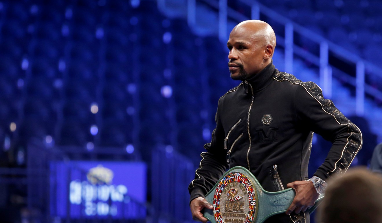 Floyd Mayweather Jnr poses with the WBC “Money Belt”. Photo: Reuters