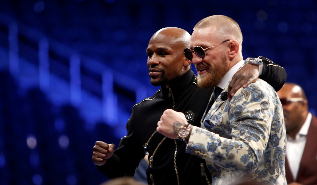 Floyd Mayweather Jnr (left) and Conor McGregor share a moment of mutual respect. Photo: Reuters