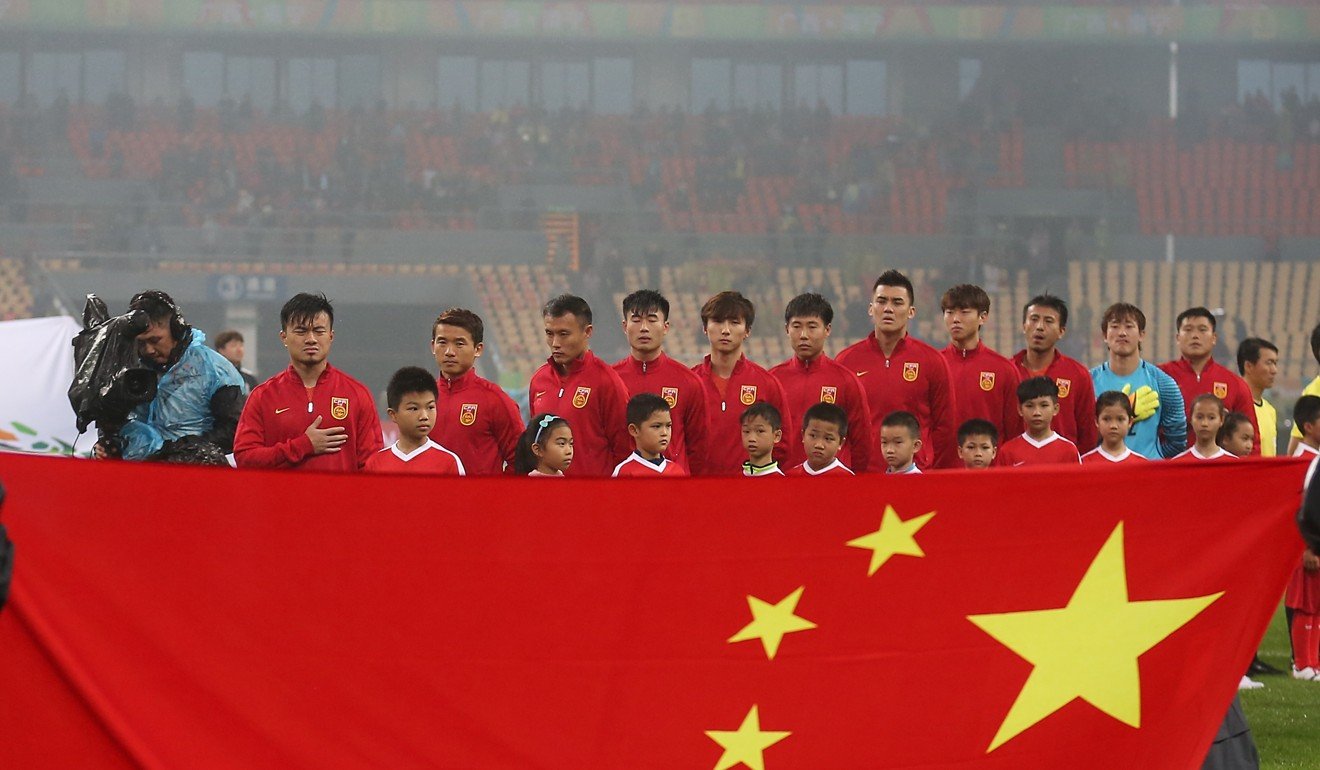 China national team soccer players listen to the anthem before a match earlier this year. Photo: Xinhua