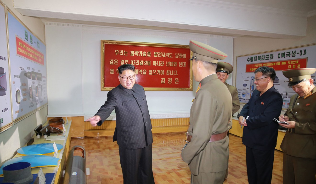 Kim Jong-un, left, visits the Chemical Material Institute of Academy of Defence Science at an undisclosed location in North Korea. Photo: AP
