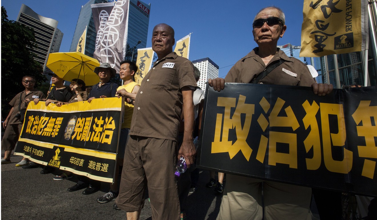 Hong Kong people march through the streets wearing prison uniforms in support of jailed activists Joshua Wong, Nathan Law and Alex Chow, on the Sunday following the judgment. The fact that some 20,000 people demonstrated that day without incident or arrest is the best proof that freedoms in Hong Kong are intact. Photo: EPA