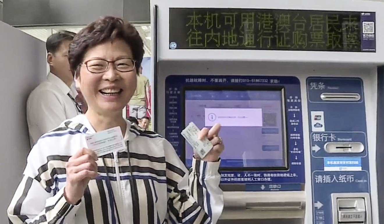 Carrie Lam next to the ticket machine which can use Hong Kong ID documents in Beijing. Photo: Handout