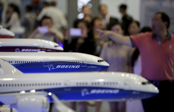 Visitors look at models of Boeing aircraft at the Aviation Expo China. Photo: Reuters