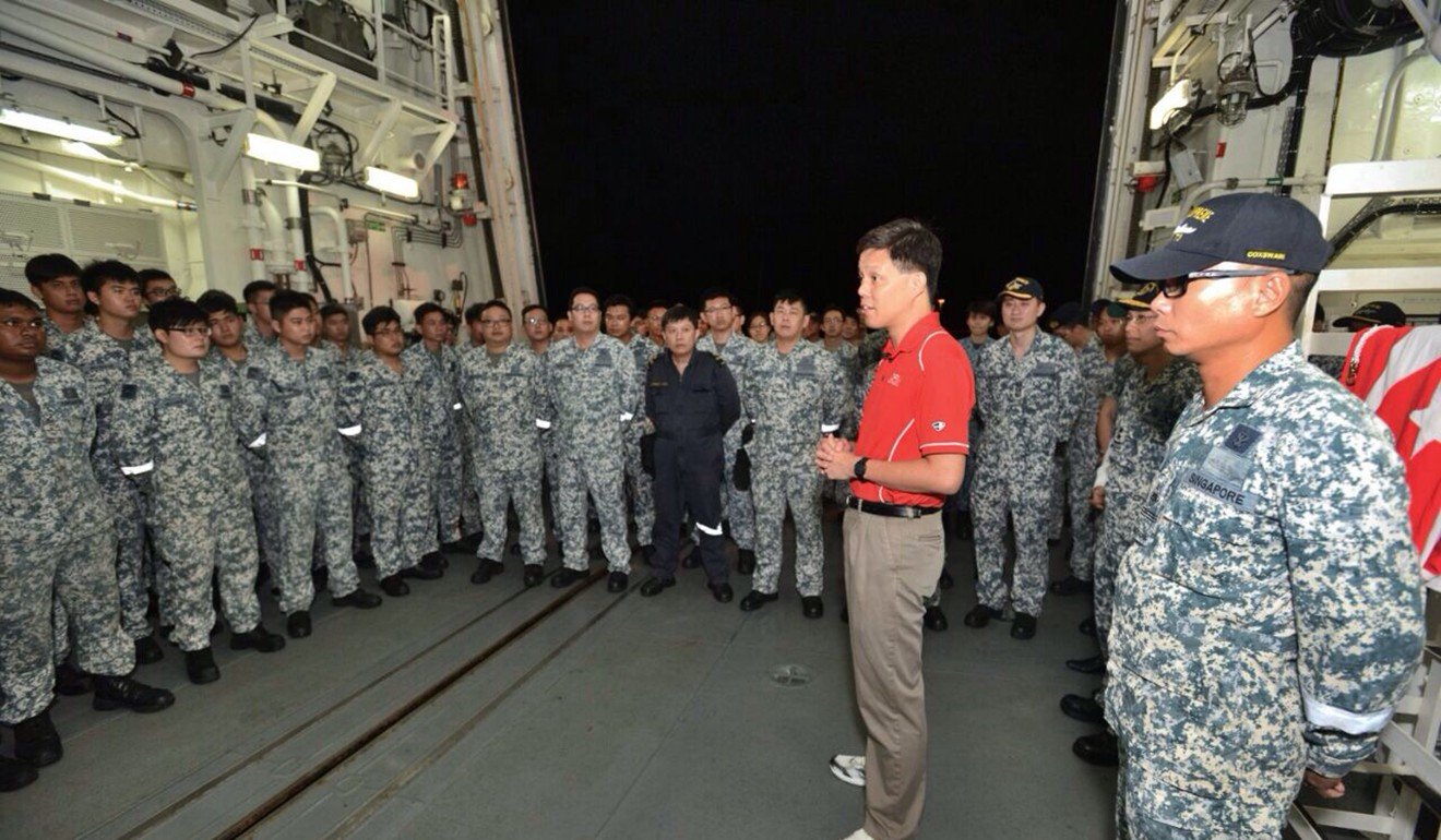 Chan Chun Sing with Republic of Singapore Navy servicemen. Photo: AFP