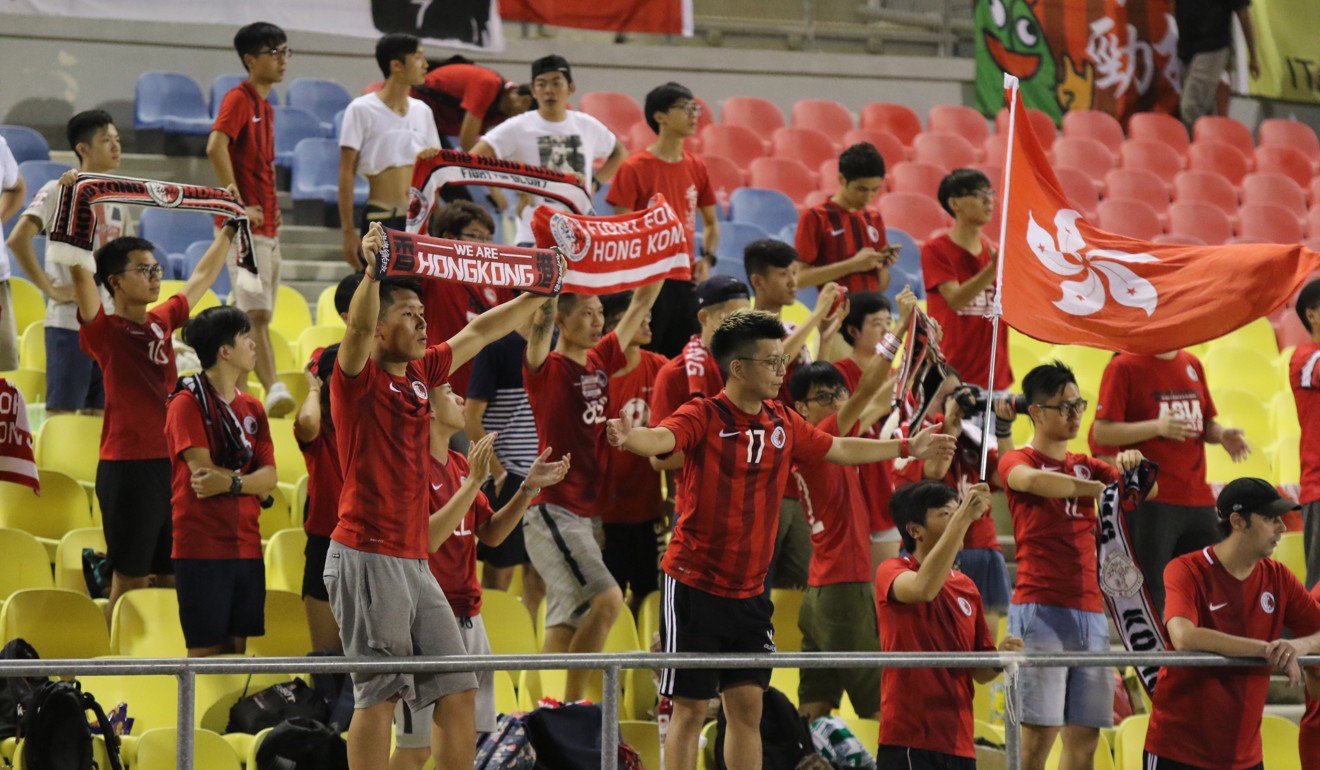 Hong Kong fans cheer their team in Malaysia.