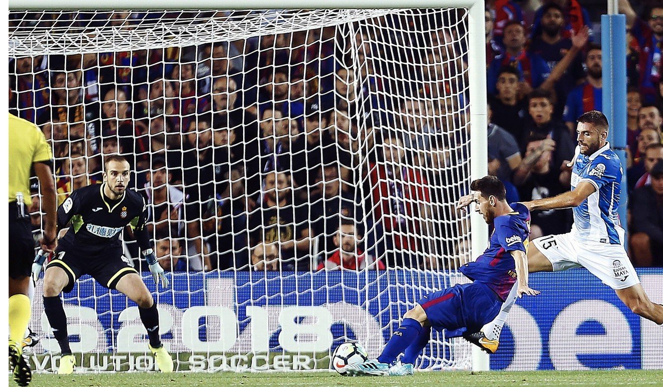 Lionel Messi (second right) opens the scoring. Photo: EPA